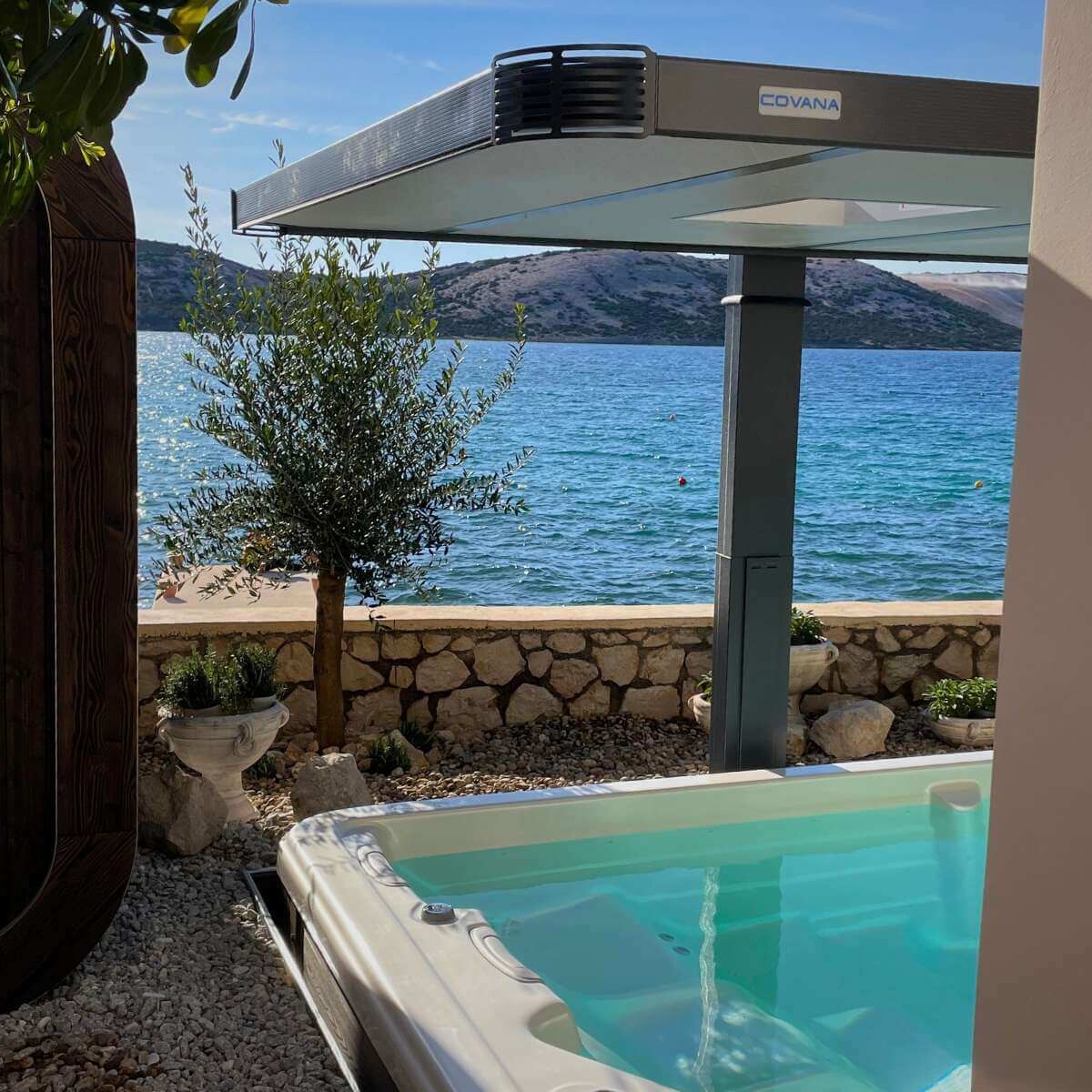 Outdoor hot tub and sauna on the island of Pag by Dream Garden - a luxurious wellness area with a sea view