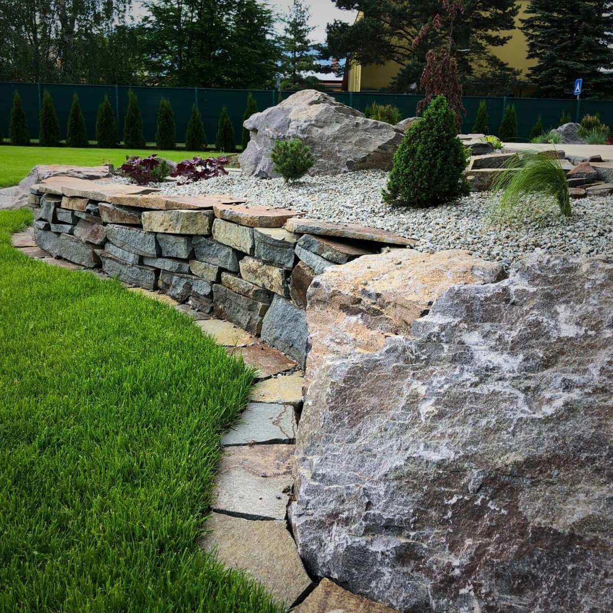 Stone wall in a modern garden from Dream Garden - natural retaining or dry stone wall as an aesthetic and functional element