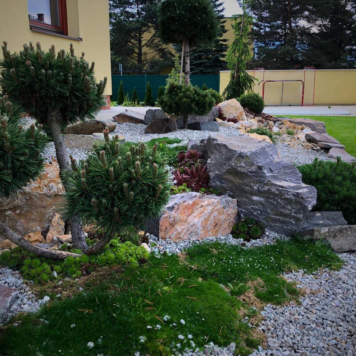 Rockery in a modern garden from Dream Garden - a design rock element with planting of ornamental plants and stones