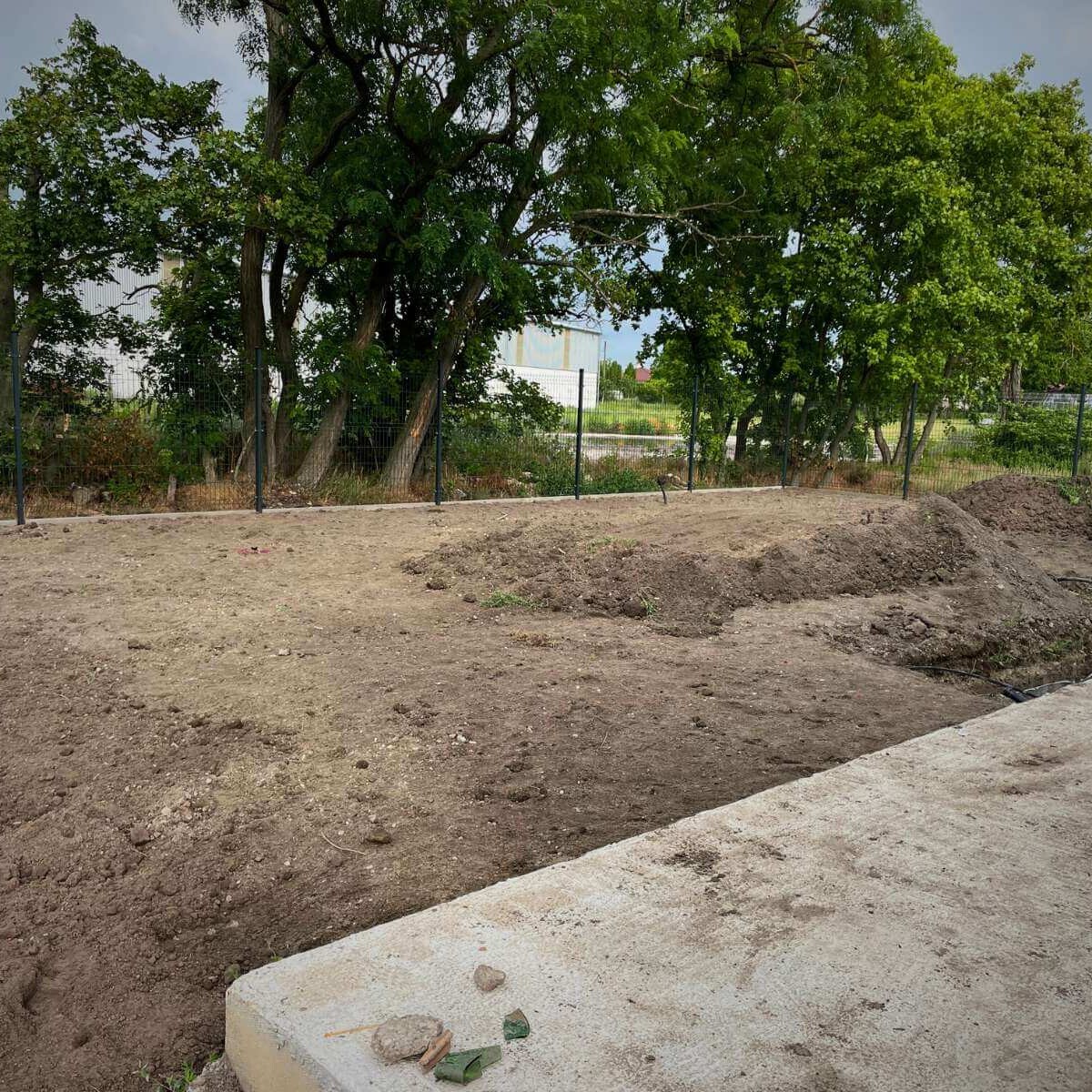 Garden preparation by Dream Garden - landscaping, planting plants and installing an irrigation system before the final exterior construction