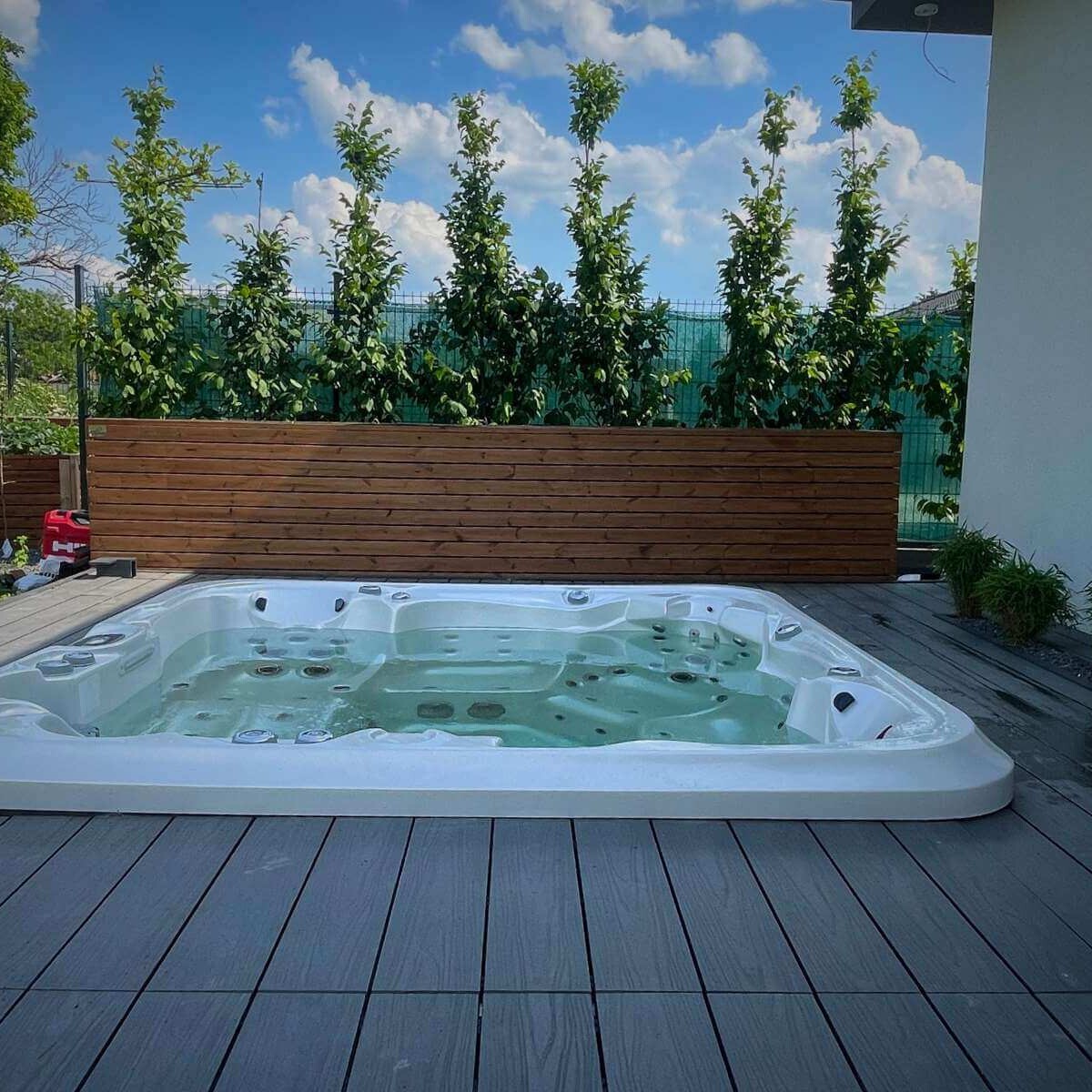 Hot tub on the terrace in the garden - a modern wellness element for relaxation and unwinding from Dream Garden