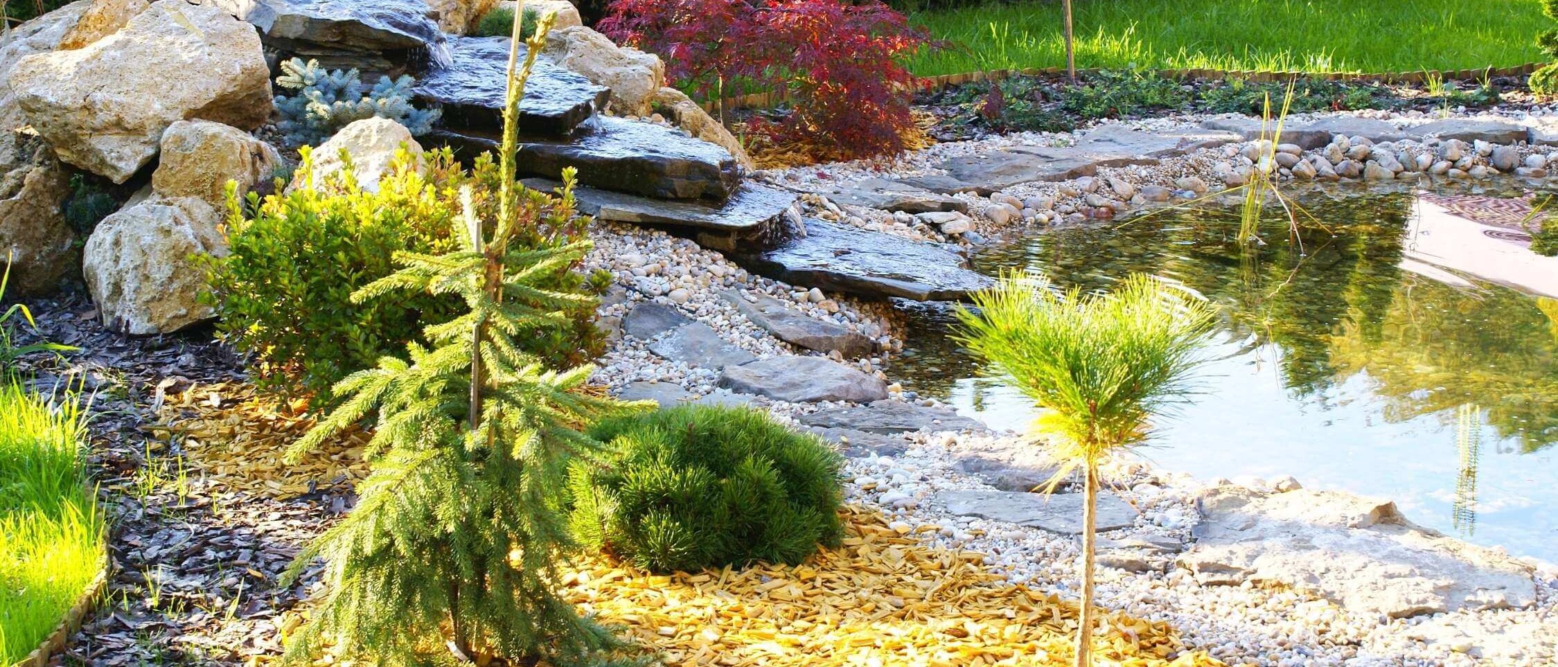 Stone garden fountain with flowing water as a decorative element in the exterior.