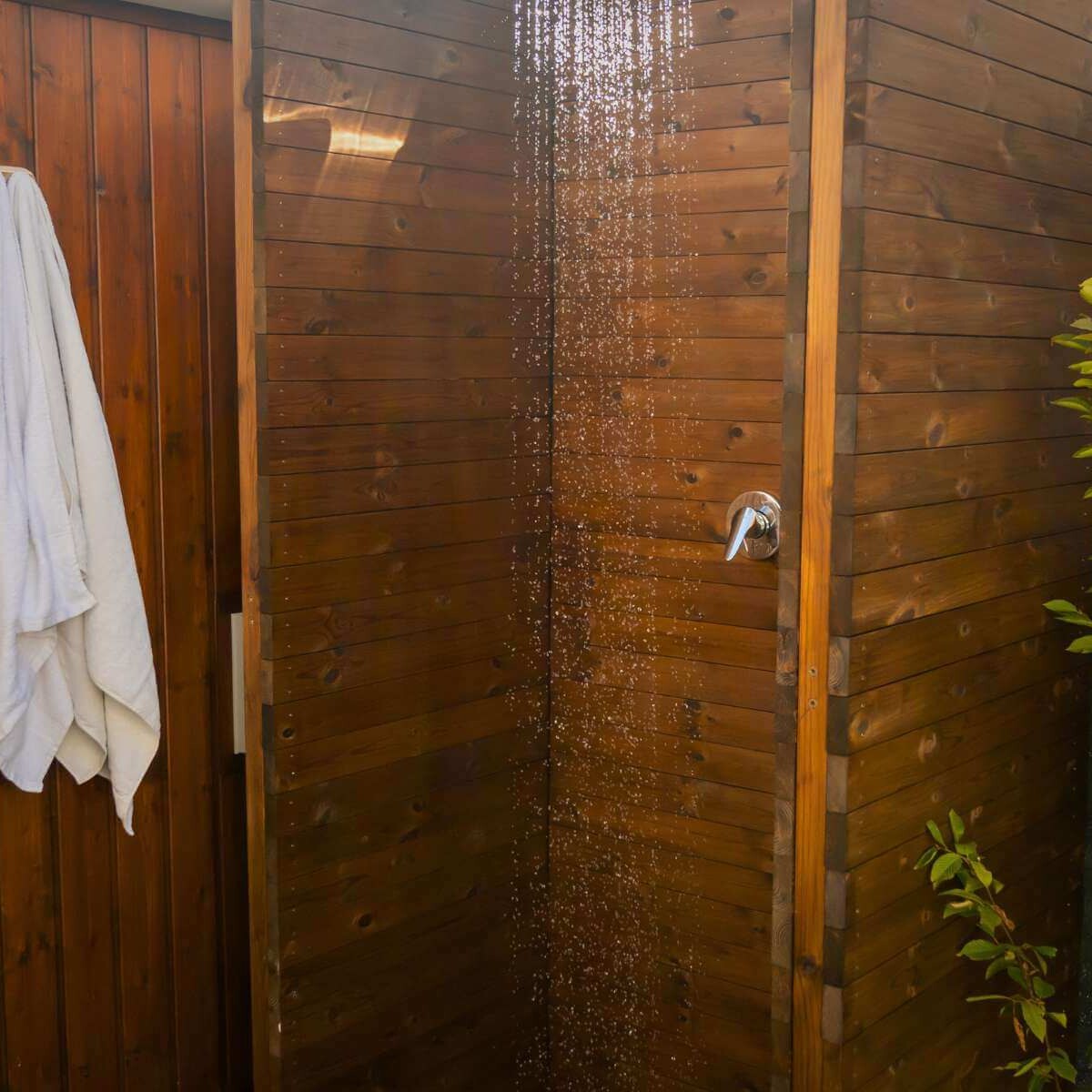 Outdoor shower in a modern garden from Dream Garden - an outdoor wellness element for refreshment and relaxation