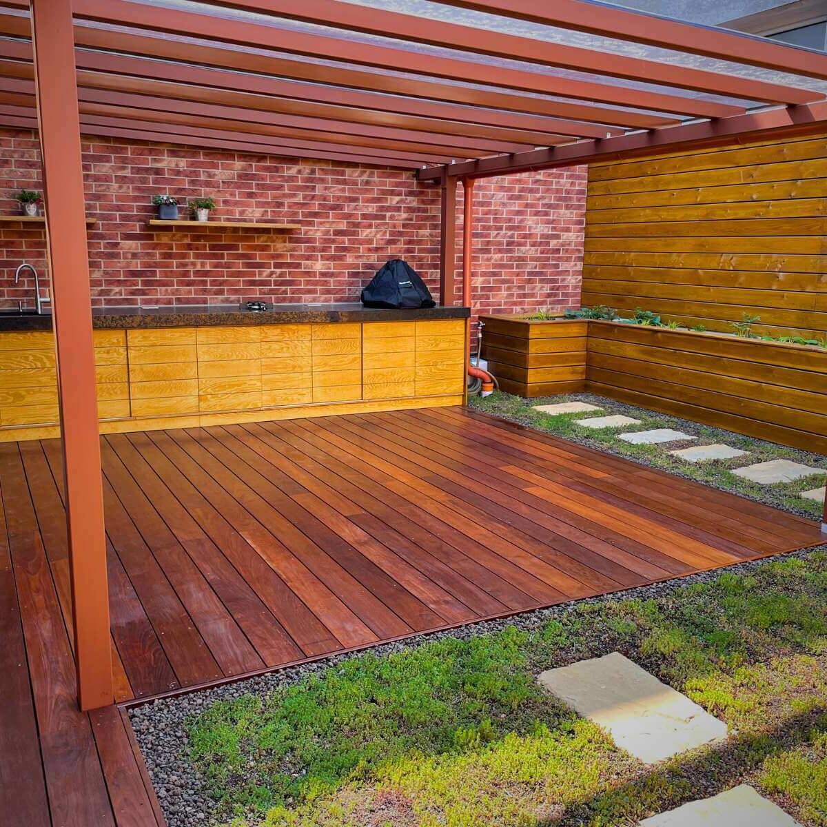 Realization of a modern outdoor terrace in Žilina by Dream Garden - terrace with an outdoor kitchen, covered roof and raised flower beds