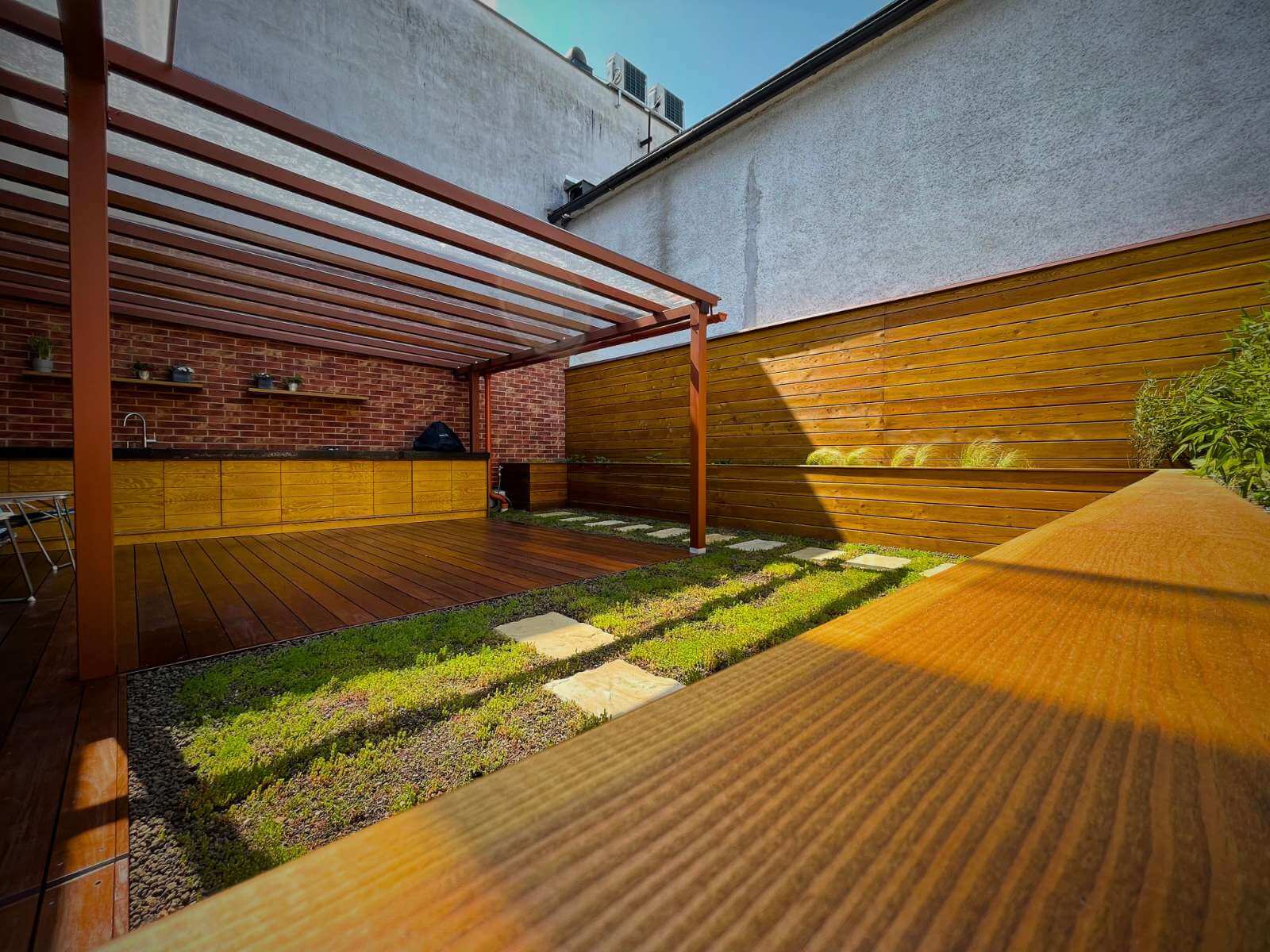Outdoor terrace in Žilina by Dream Garden - modern outdoor space with kitchen, covered roof and raised beds for comfortable dining